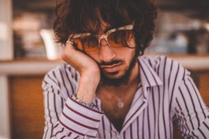 Inspire designz: Photo of man frustrated sitting at table