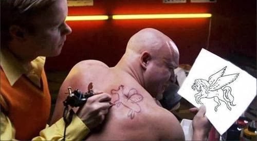 What is click funnels: photo of man getting a tatoo that is done incorrectly and looks nothing like the tattoo he wanted.