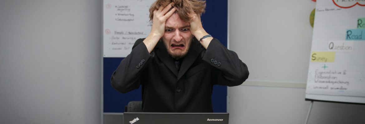 affiliate marketing and facebook ads: photo of man frustrated at the computer