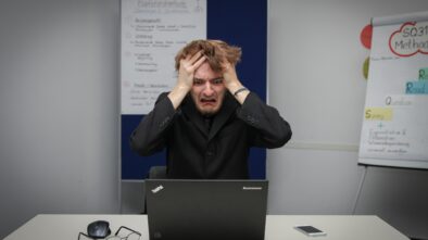 affiliate marketing and facebook ads: photo of man frustrated at the computer