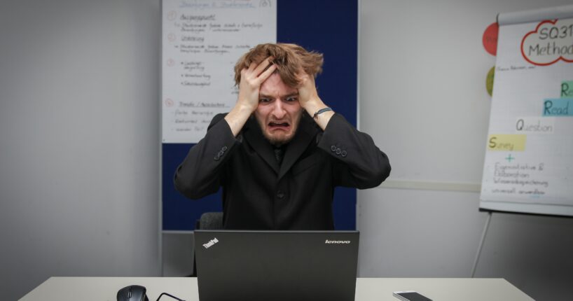 affiliate marketing and facebook ads: photo of man frustrated at the computer