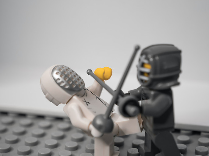 How To Optimize Google Ads: Photo Of 2 Lego Men Having A Sword Fight
